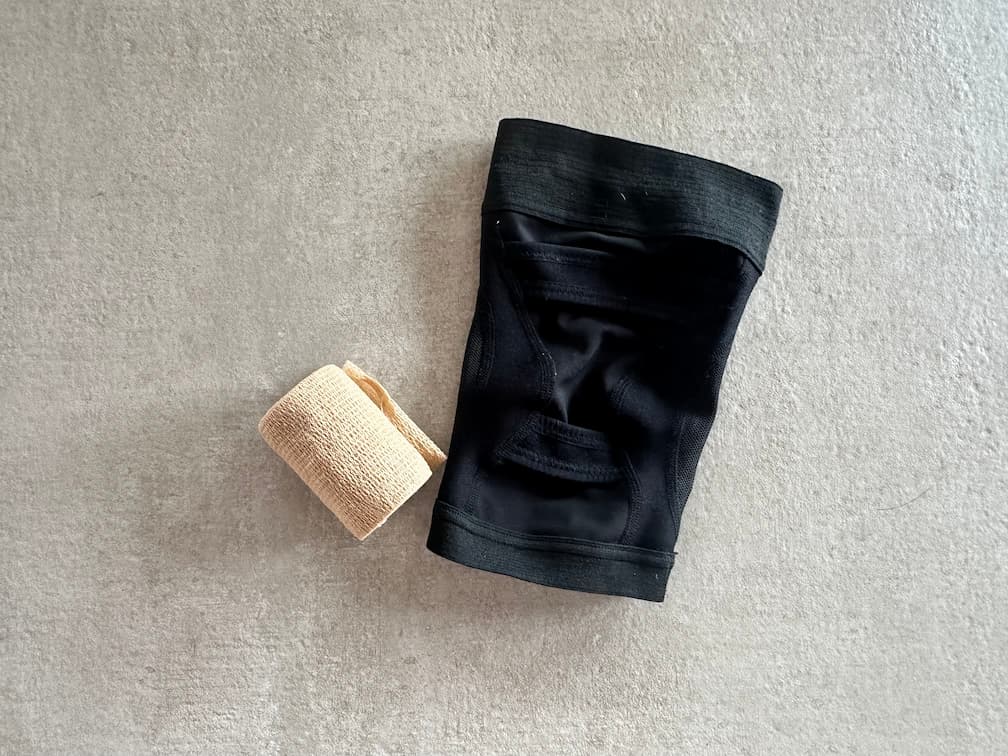 Compression knee sleeve worn in an airport to control swelling and feel stable after ACL surgery